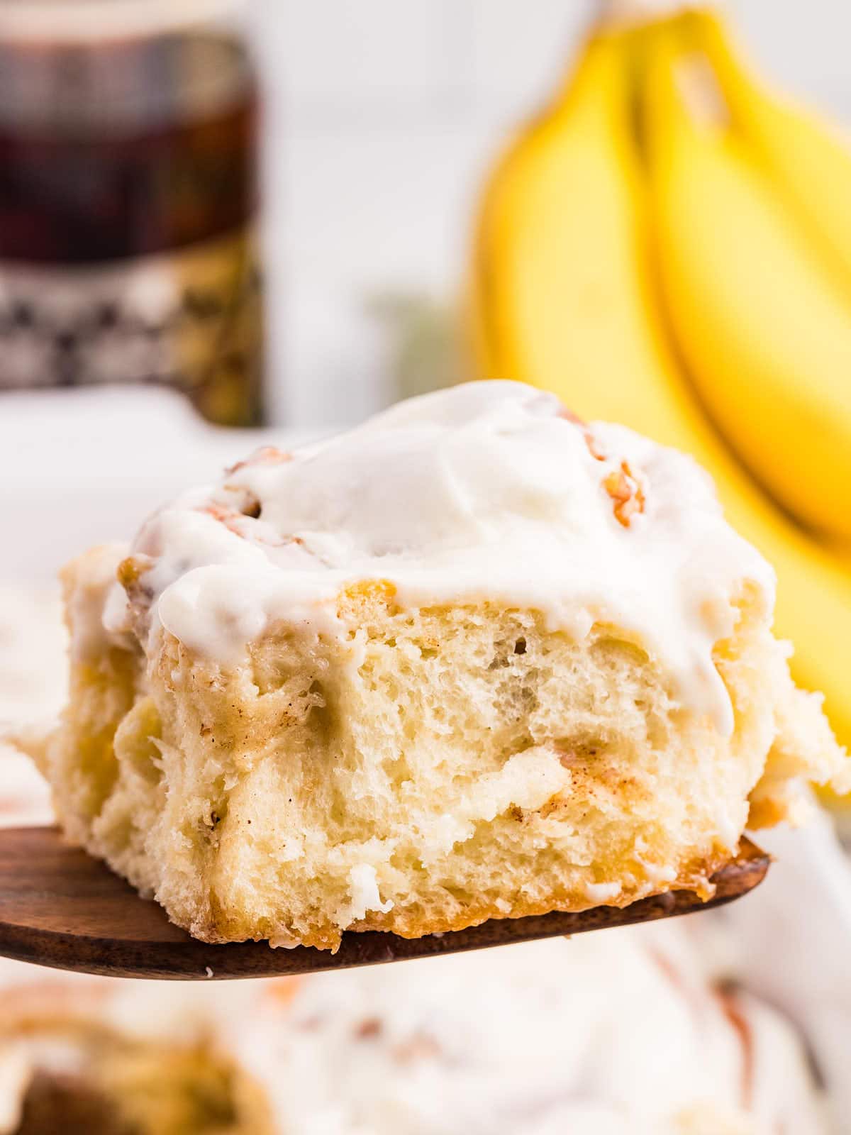 A slice of Banana Cinnamon Roll serving spatula.