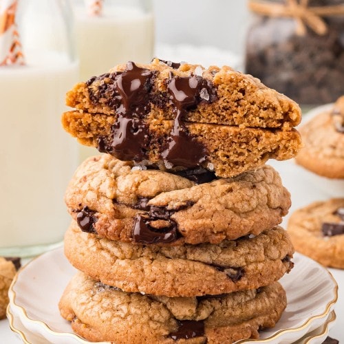 A stack of Brown Butter Chocolate Chip Cookies on white plate.