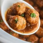 A spoonful of Crockpot Meatballs and Gravy.