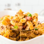 A serving spoon full of a Hamburger Casserole.