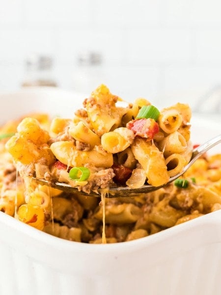 A serving spoon full of a Hamburger Casserole.