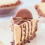 A slice of No-Bake Peanut Butter Pie drizzled with chocolate syrup on top.