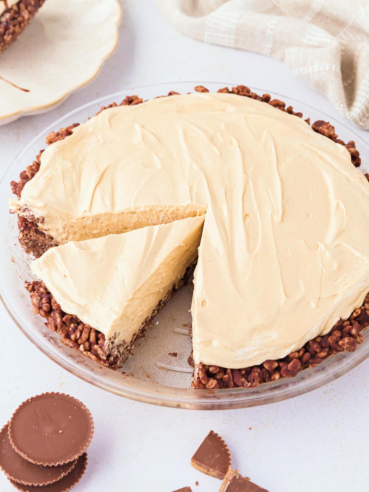 A No-Bake Peanut Pie with a slice cut out.