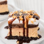 A slice of No-Bake Peanut Butter Lasagna served on a white plate.