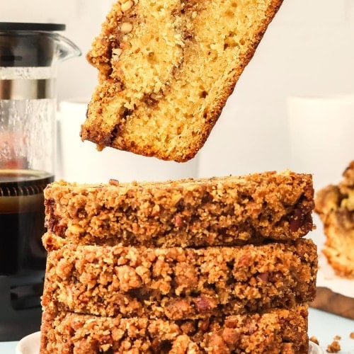 Picking up a slice of Pecan Bread.