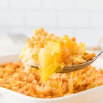 A serving spoonful of Pineapple Casserole.