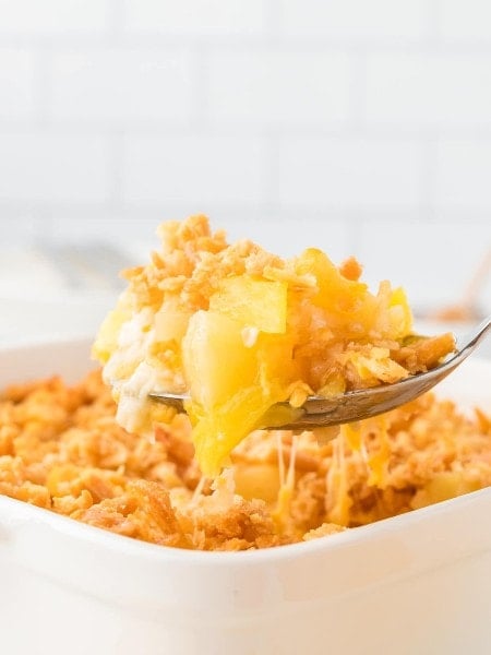 A serving spoonful of Pineapple Casserole.