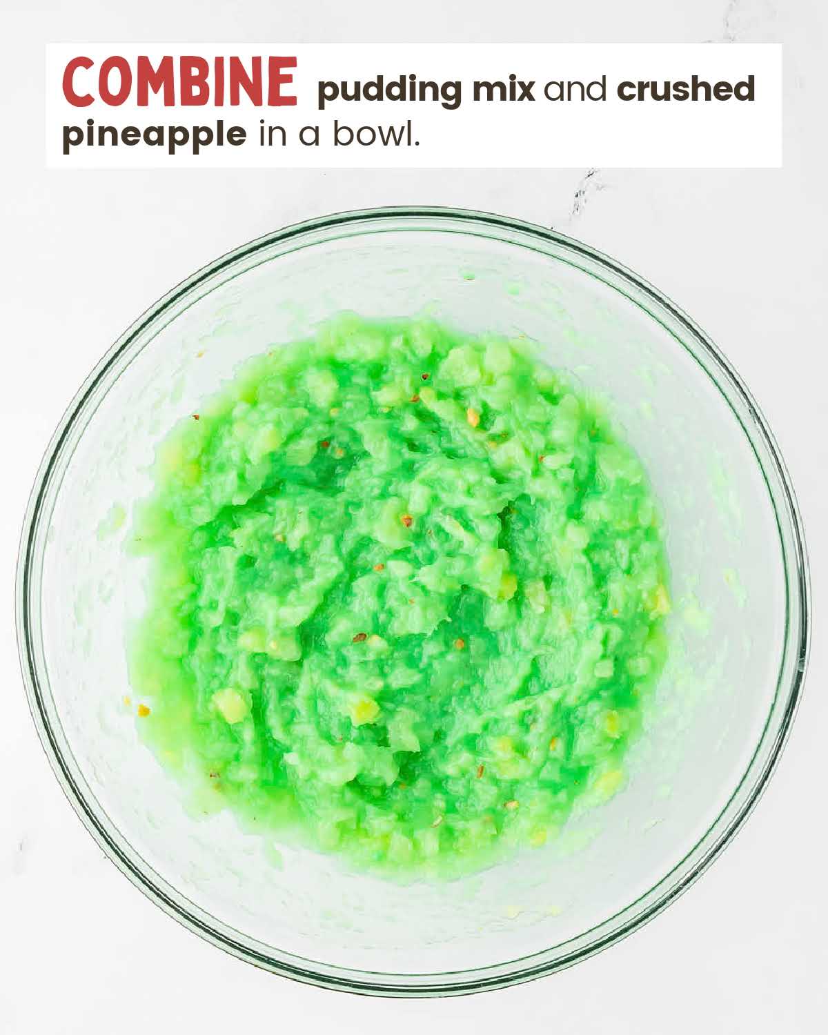 Pudding mix and crushed pineapple in a bowl.