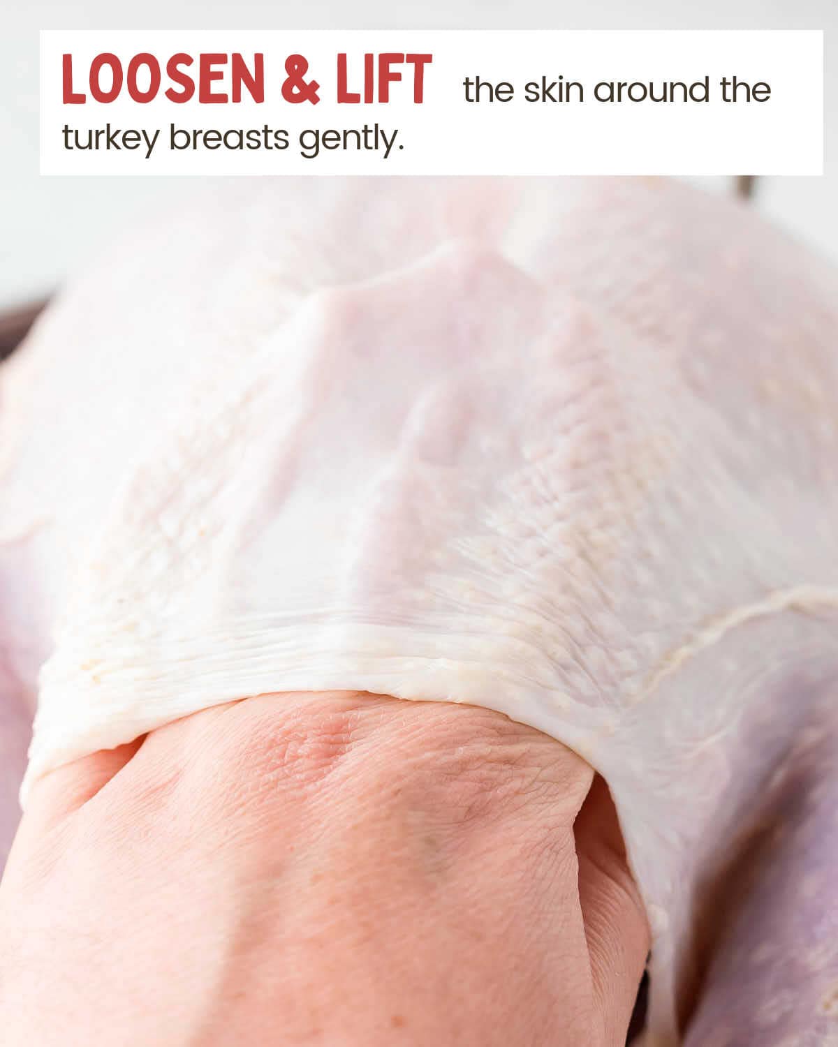 Loosening the skin of the turkey.
