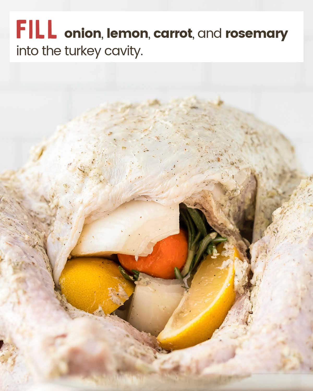 Fill the cavity with vegetables, lemon, and herbs.