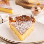 A slice of Chess Pie on a white plate.