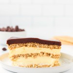 A slice of No-Bake Eclair Cake on a white plate.