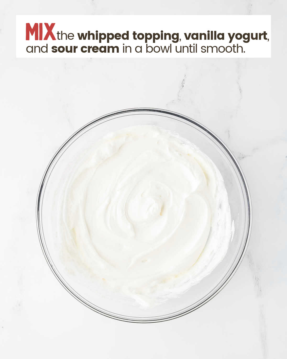 Whipped topping, vanilla yogurt, and sour cream mixed in a bowl.