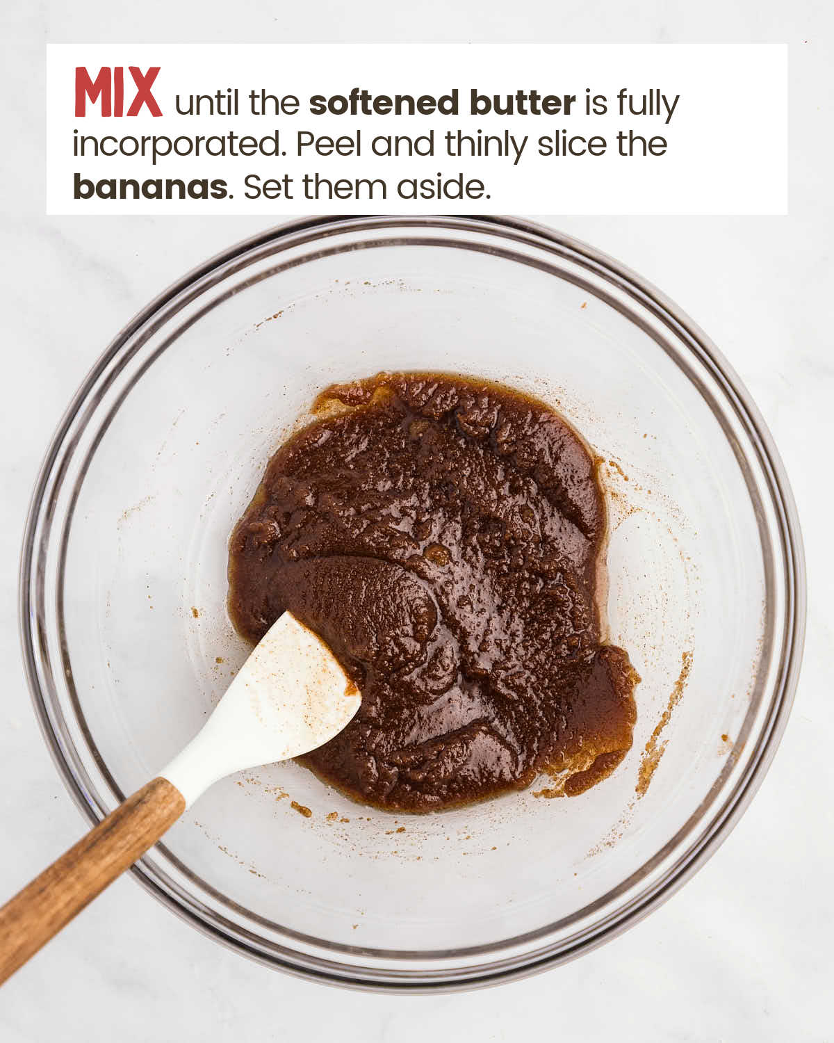 Butter, brown sugar, salt, and cinnamon mixed with a spatula in a glass bowl.