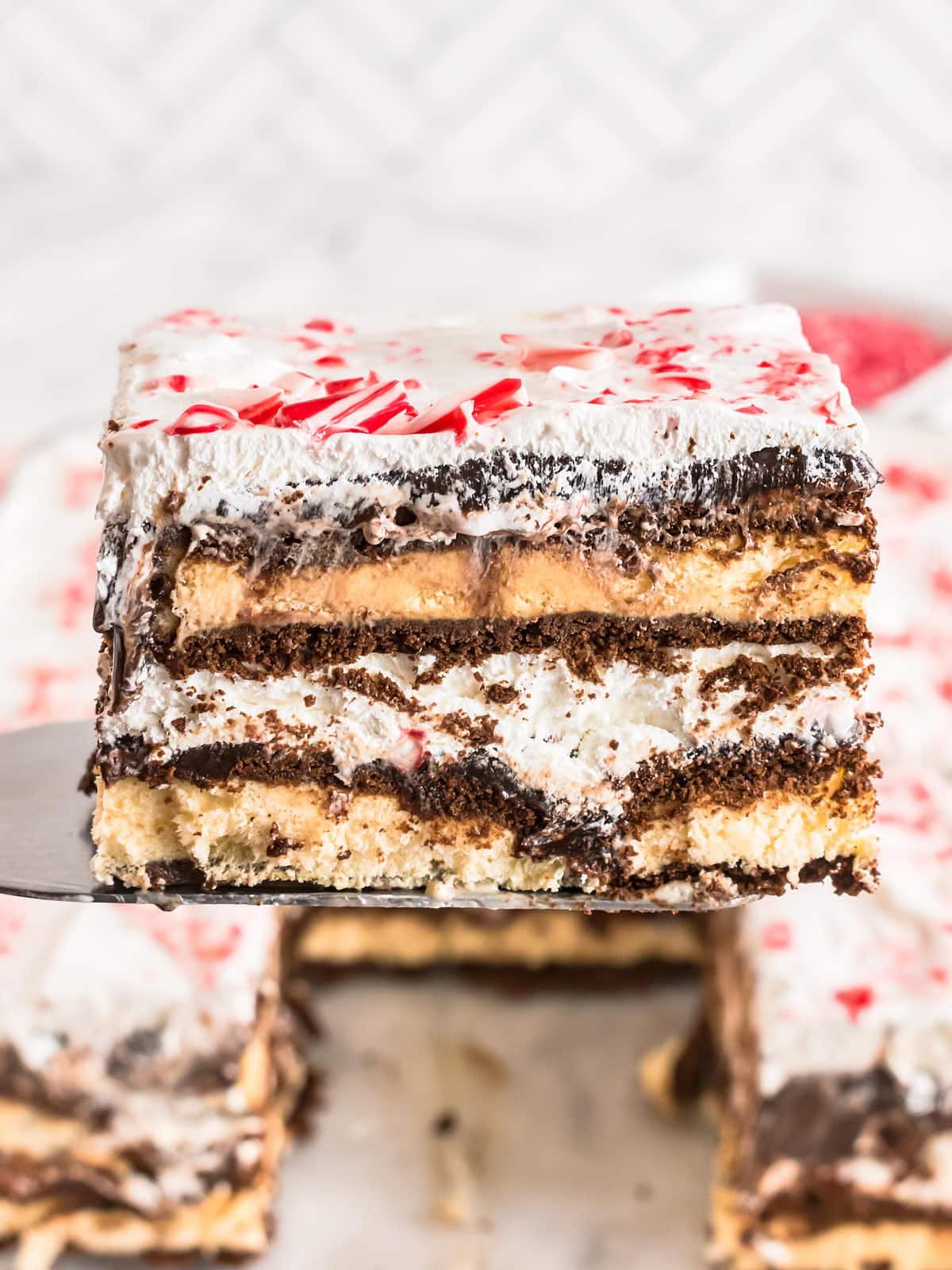 Lifting a slice of Christmas Icebox Cake.
