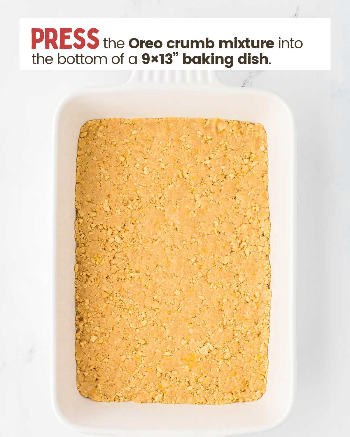 Golden Oreo crumb crust in a baking dish.