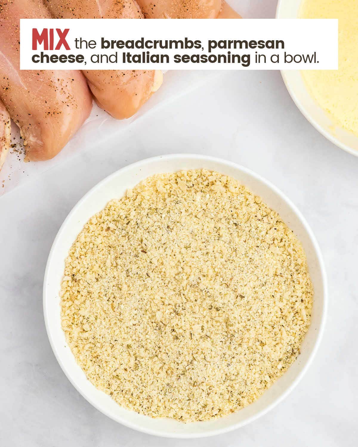 Breadcrumbs, parmesan cheese, and Italian seasoning in a bowl.