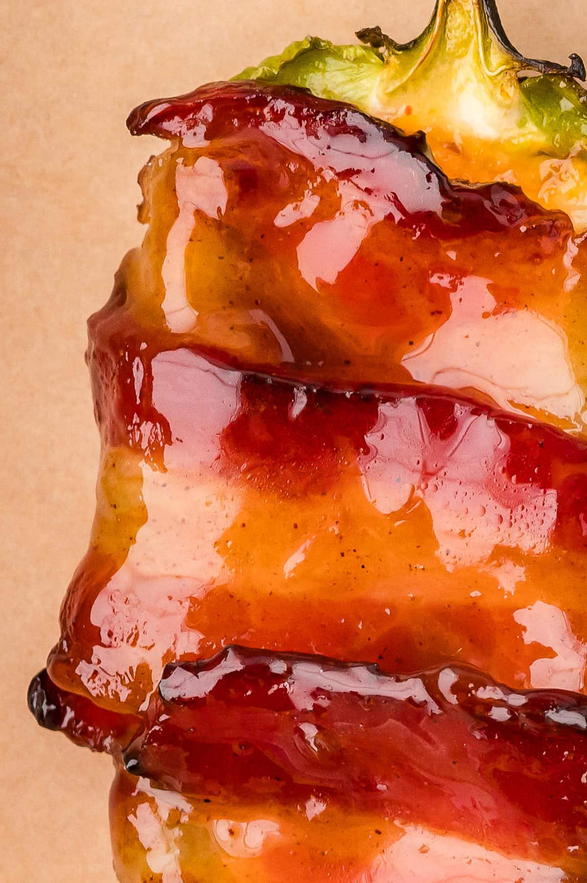 Closeup of a single Bacon Wrapped Jalapeno Poppers.