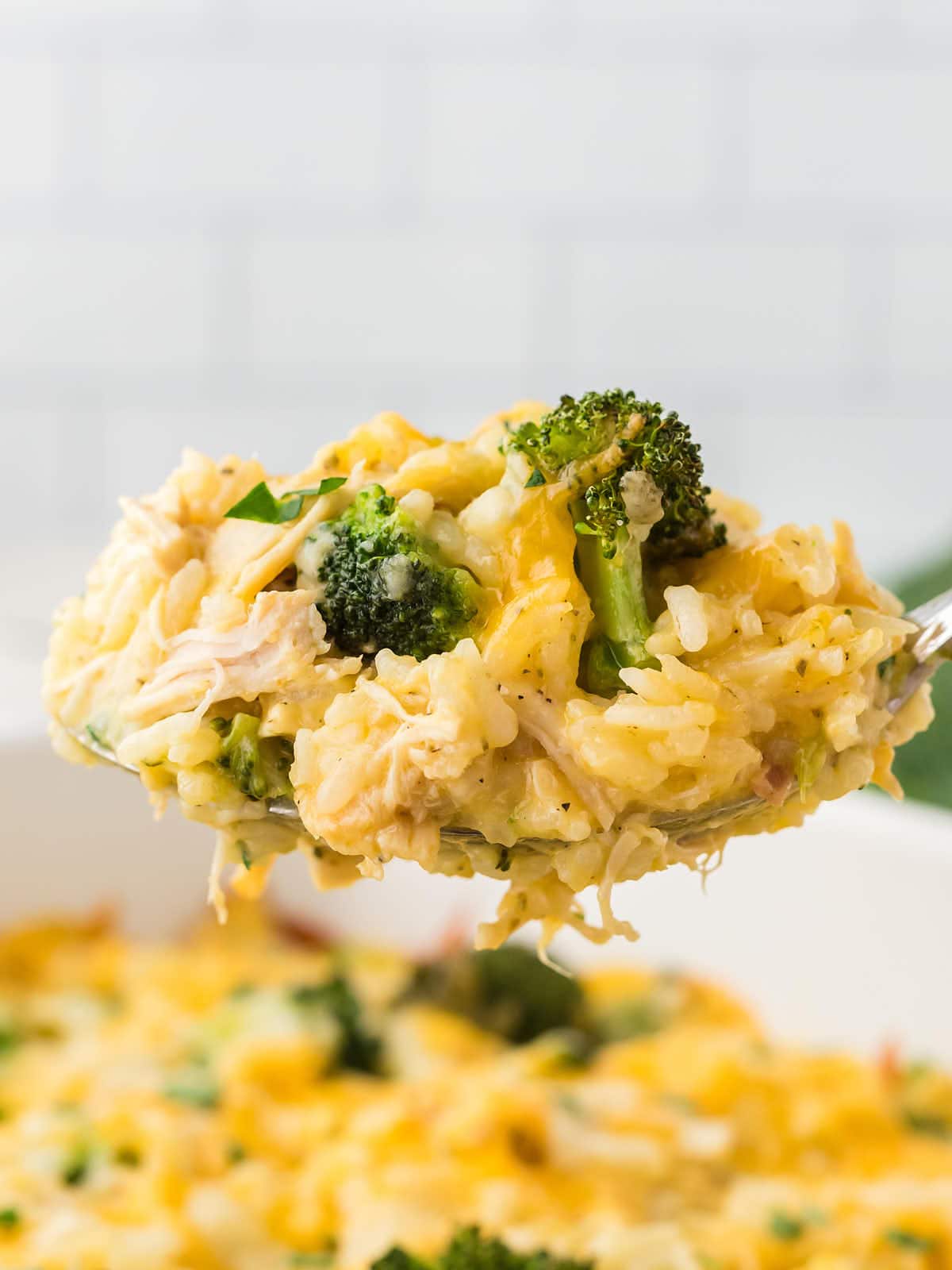 A spoonful of a Chicken Broccoli Rice Casserole.