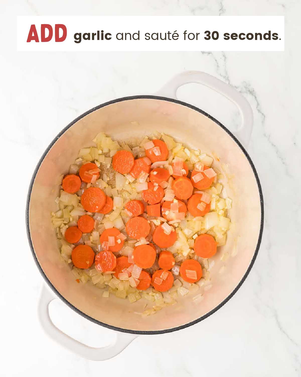 Garlic, onions and carrots in a large pot.