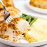 A forkful of Parmesan Crusted Chicken.