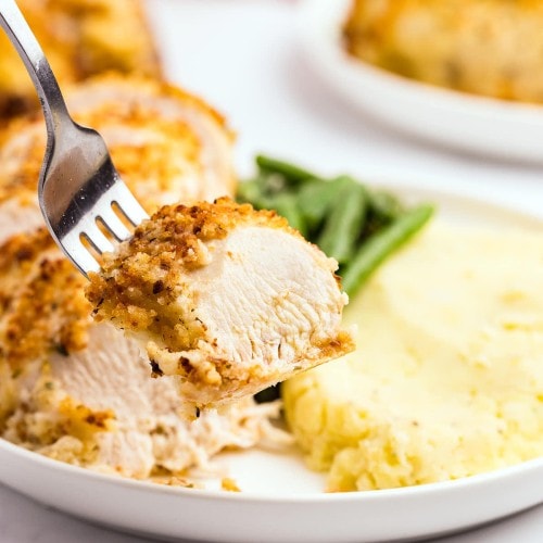A forkful of Parmesan Crusted Chicken.