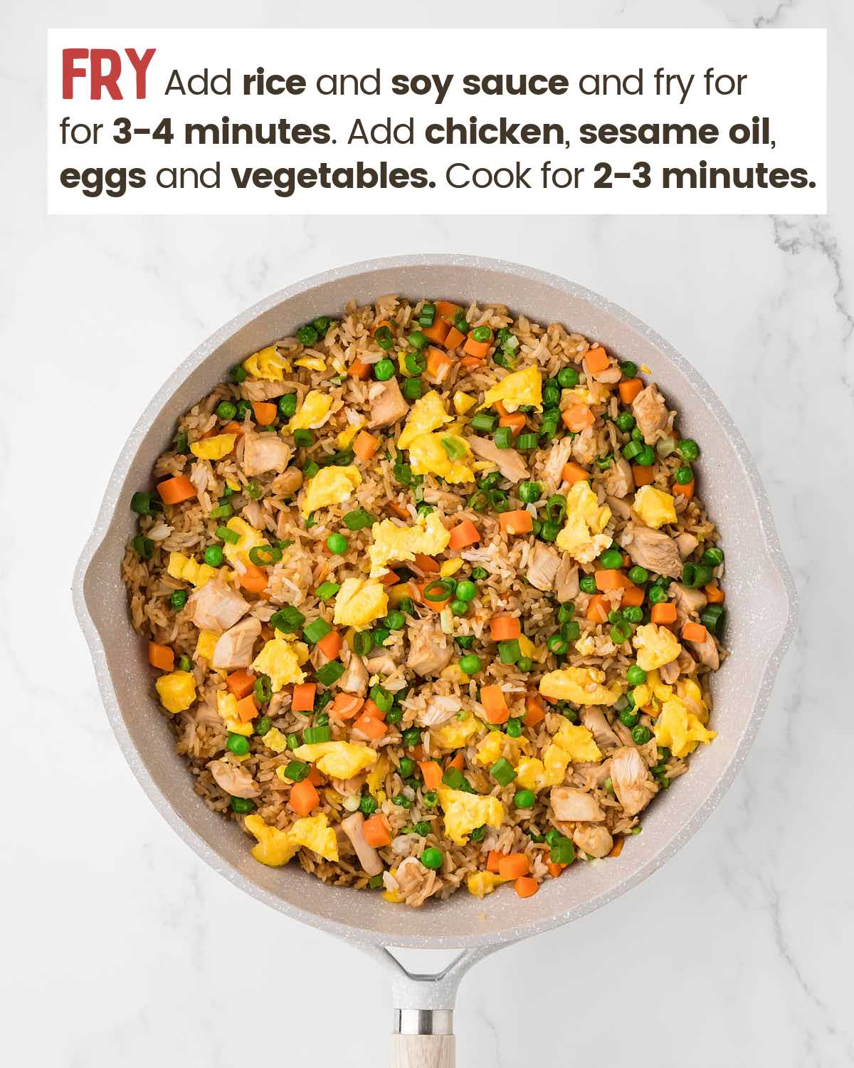Chicken fried rice in a pan.