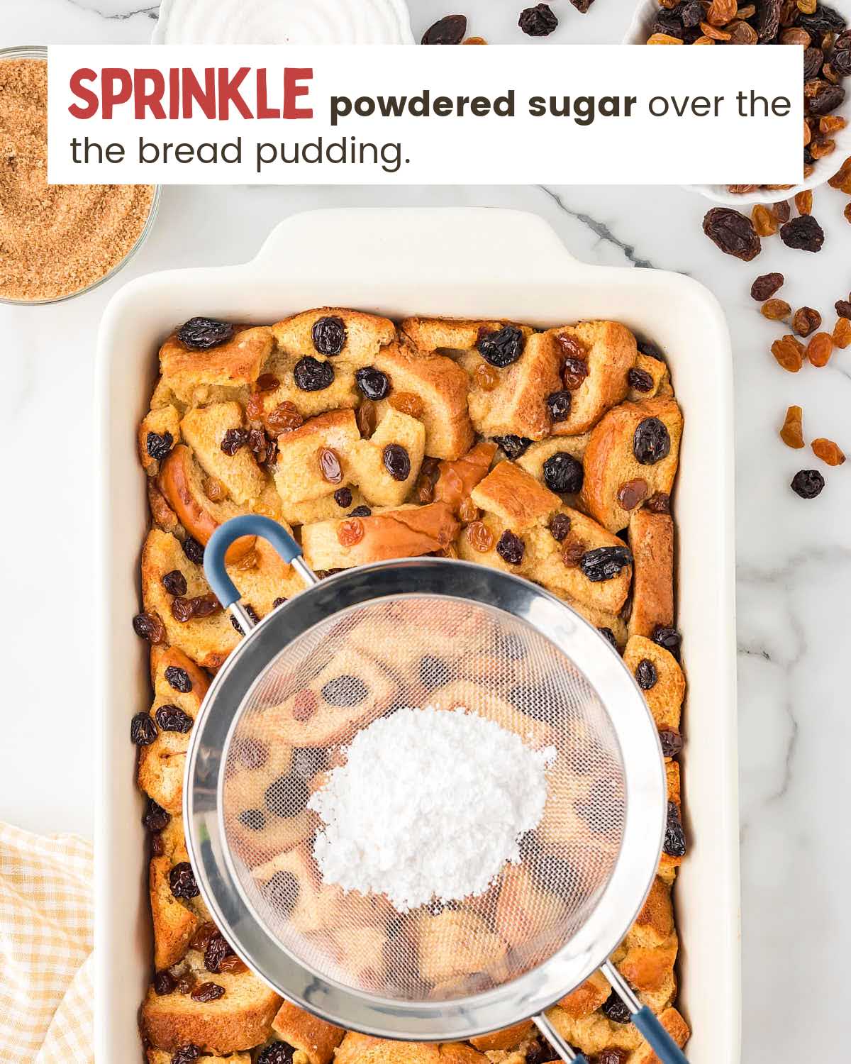 Powdered sugar over baked bread pudding.
