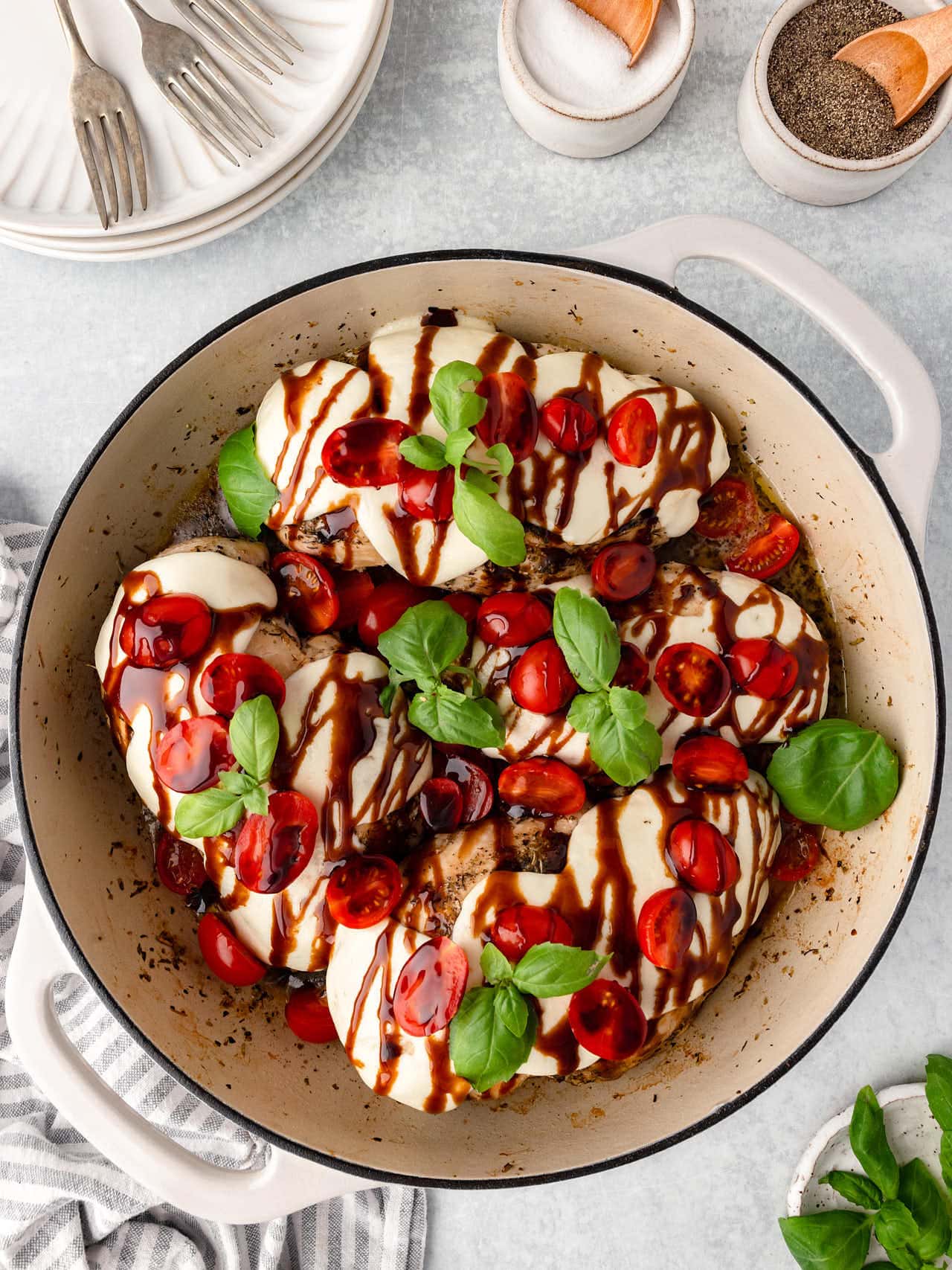 Baked Chicken Caprese in a skillet.