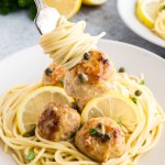A forkful of spaghetti with a Chicken Piccata Meatball.