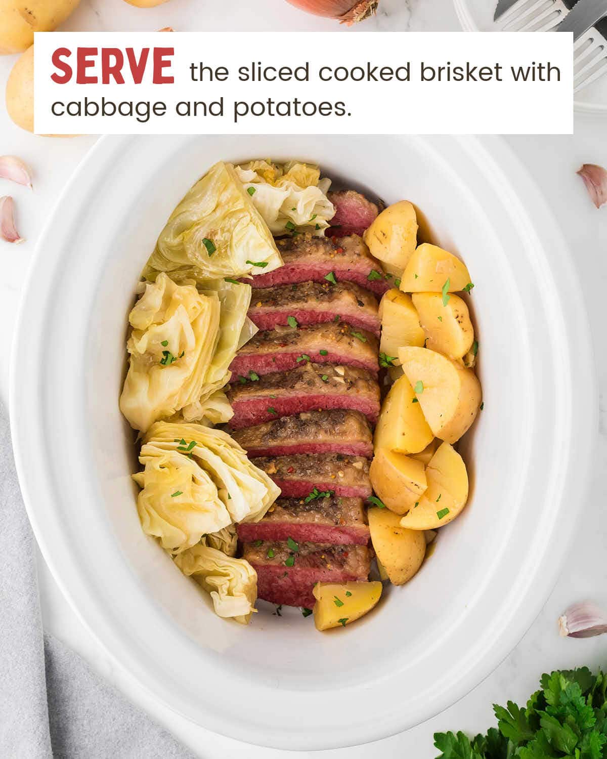 Corned beef brisket slices, cabbage, and potatoes in a slow cooker.