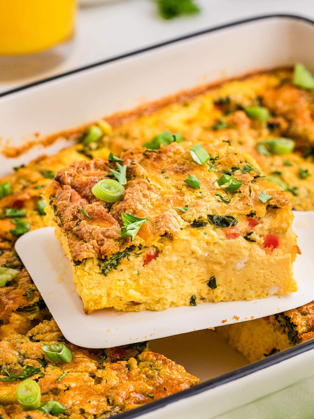 A spatula with a slice of Cottage Cheese Egg Bake.
