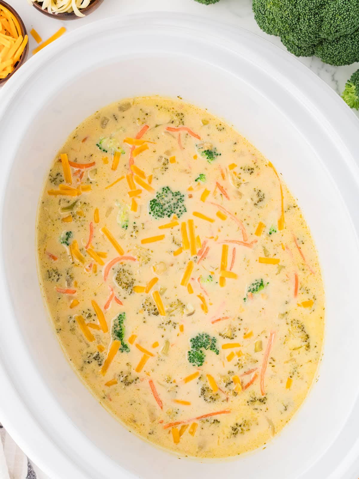 Topdown view of Cheesy Broccoli Cheddar Soup in a Crockpot.