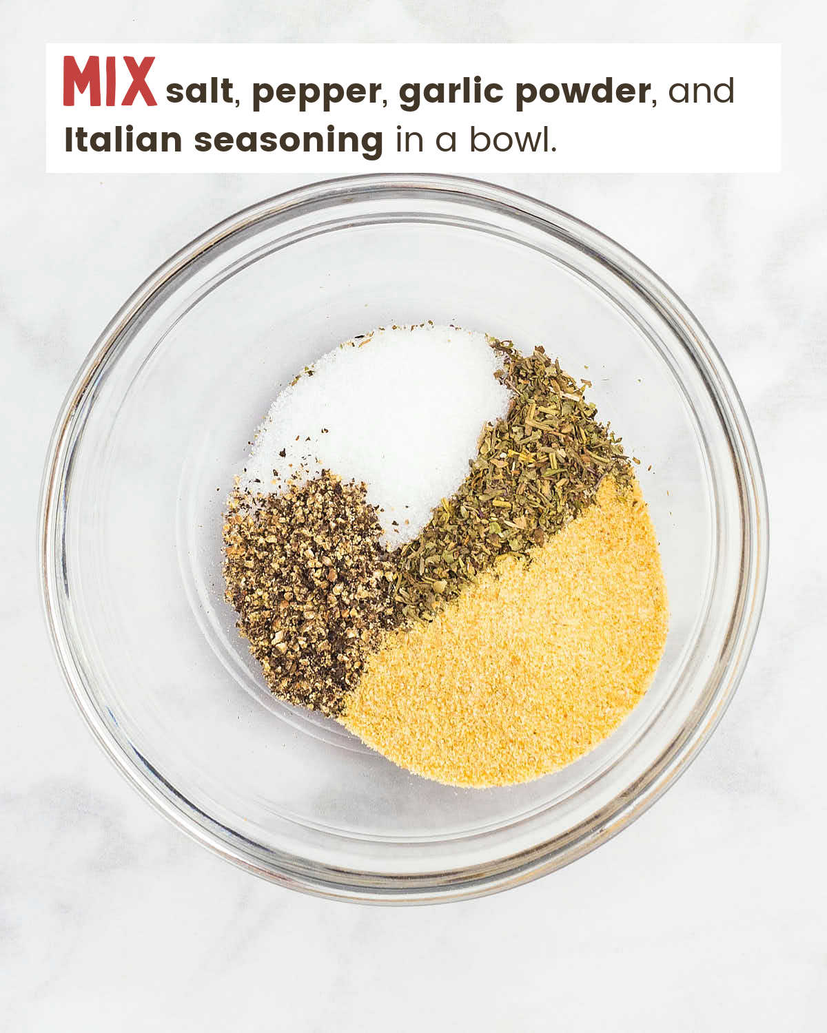 Salt, pepper, garlic powder, and Italian seasoning in a bow. 