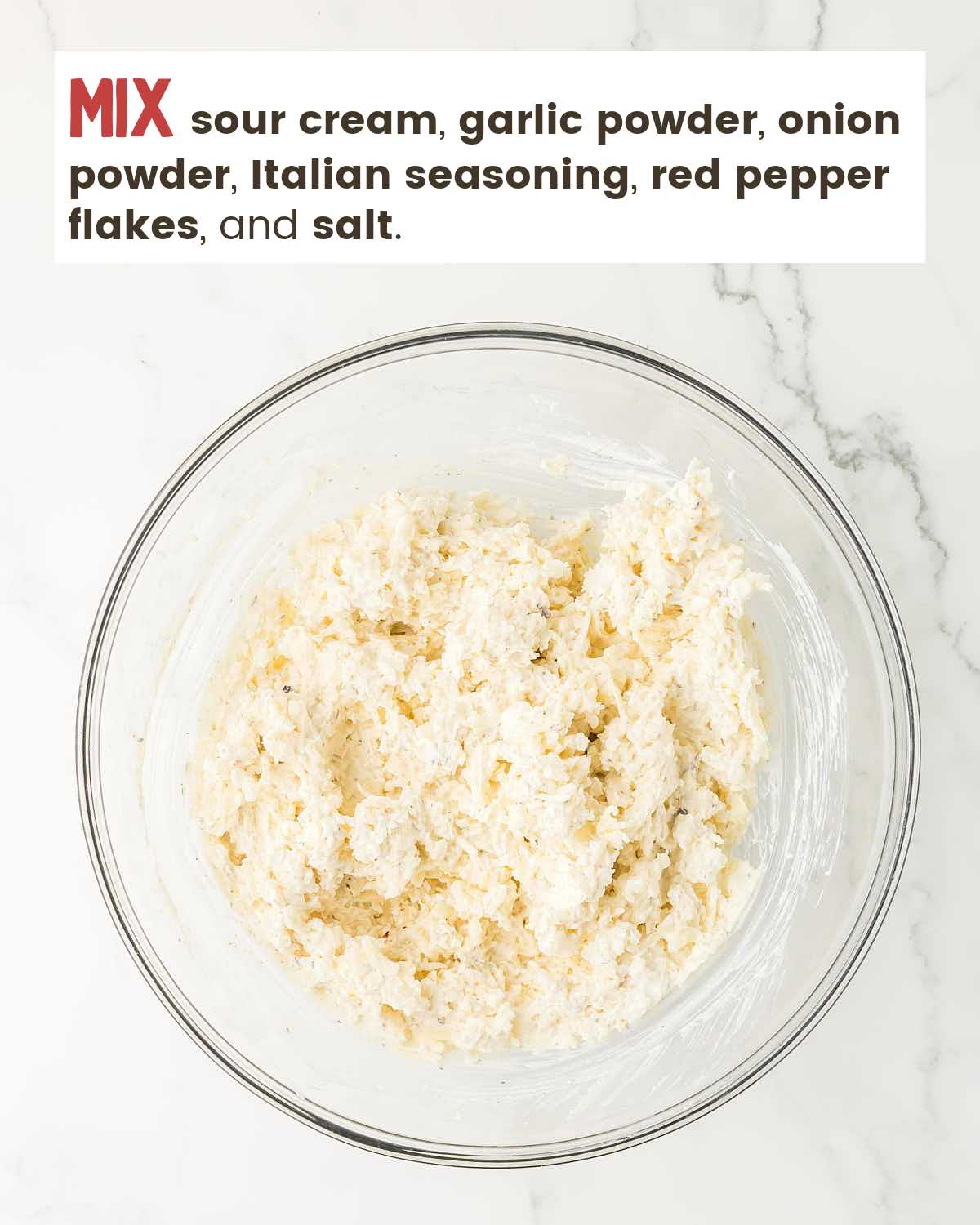 Sour cream mixed with spices in bowl. 
