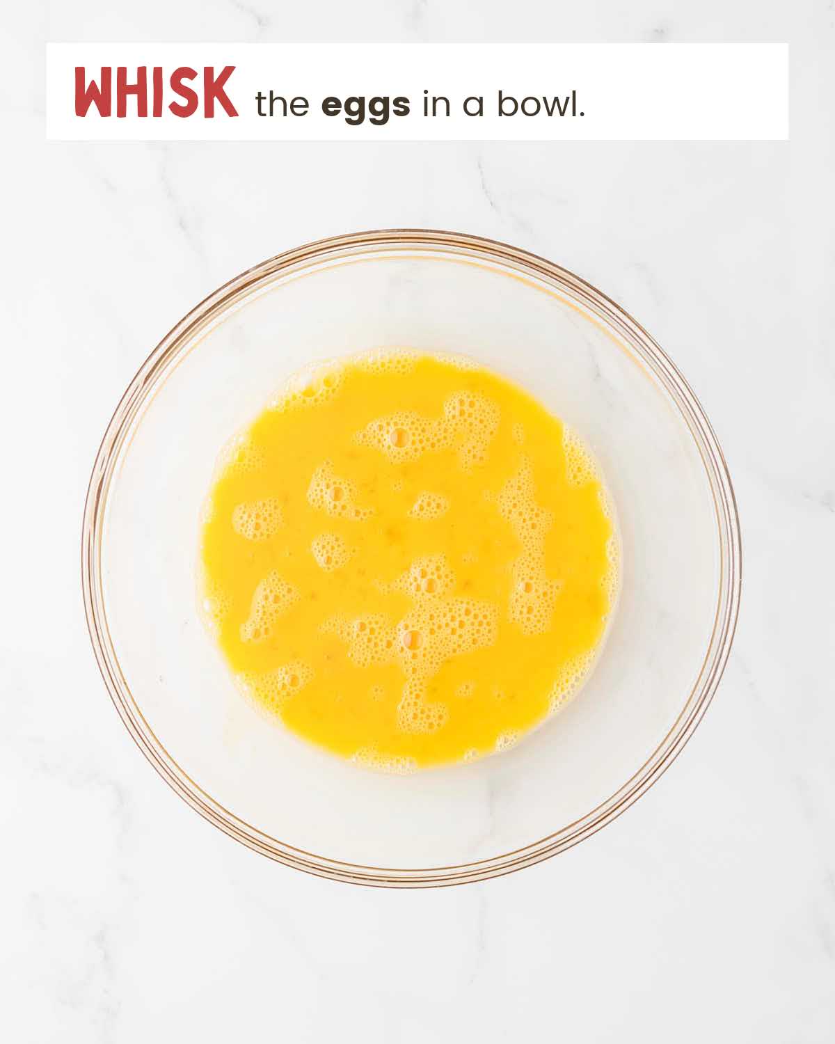 Whisked eggs in a bowl.