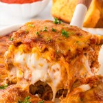 A spatula with a slice of homemade Lasagna.