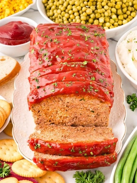 Sliced Meatloaf on a white plate.