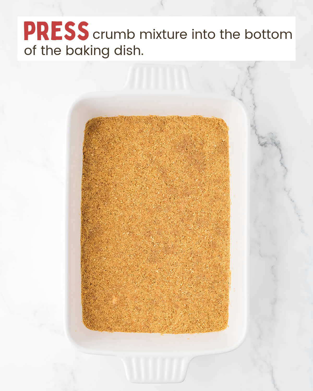 Graham cracker crumb mixture pressed into bottom of a baking dish.