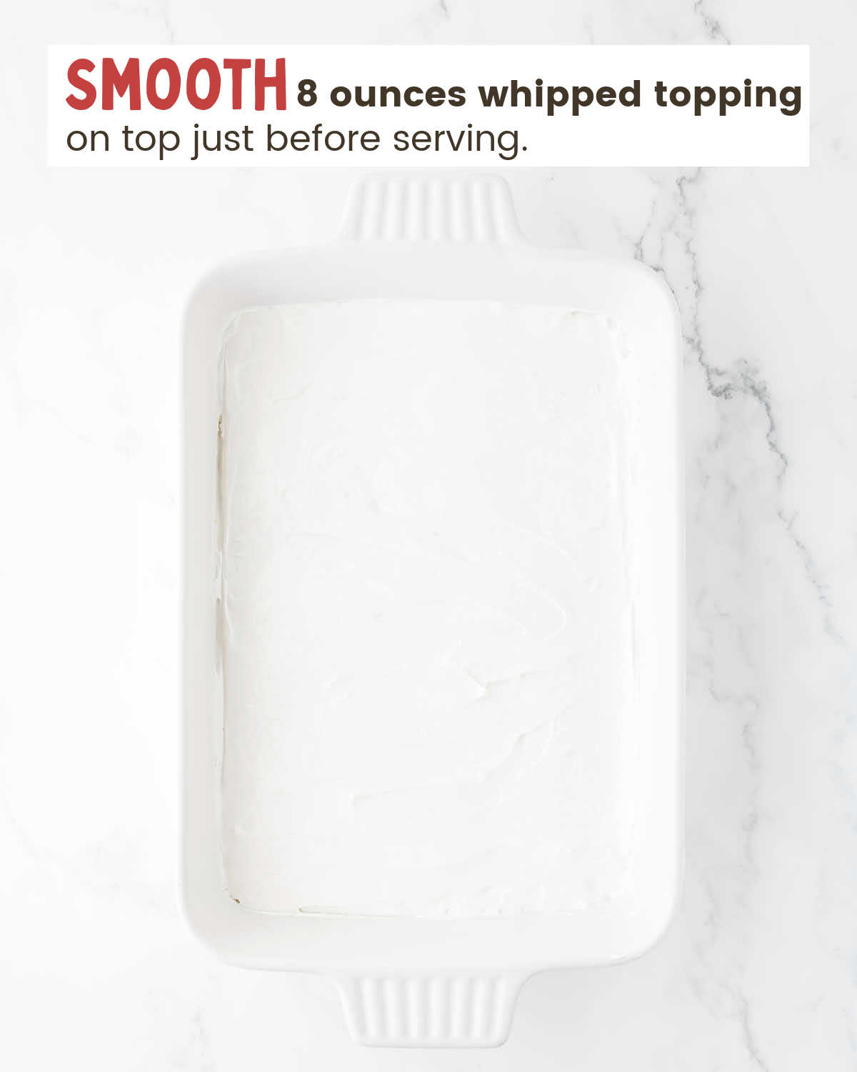 Whipped topping layer in a baking dish.