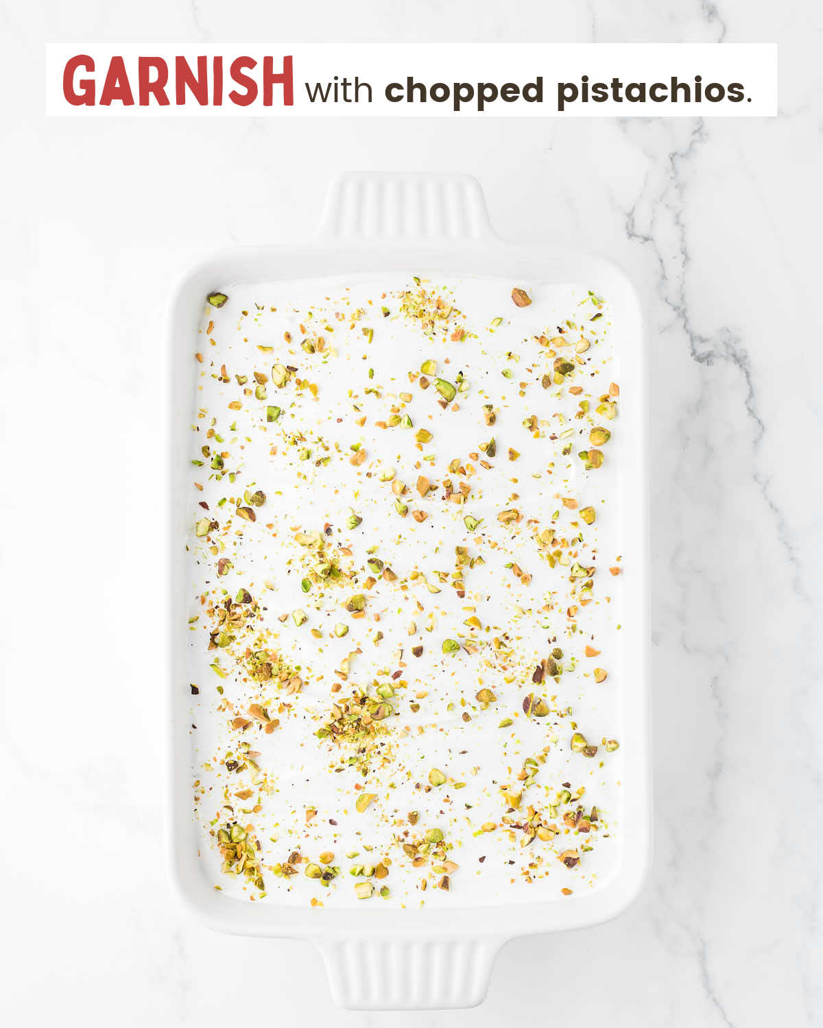 Pistachio Lush topped with chopped pistachios in a baking dish.