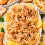 Shrimp Scampi served family style over spaghetti.