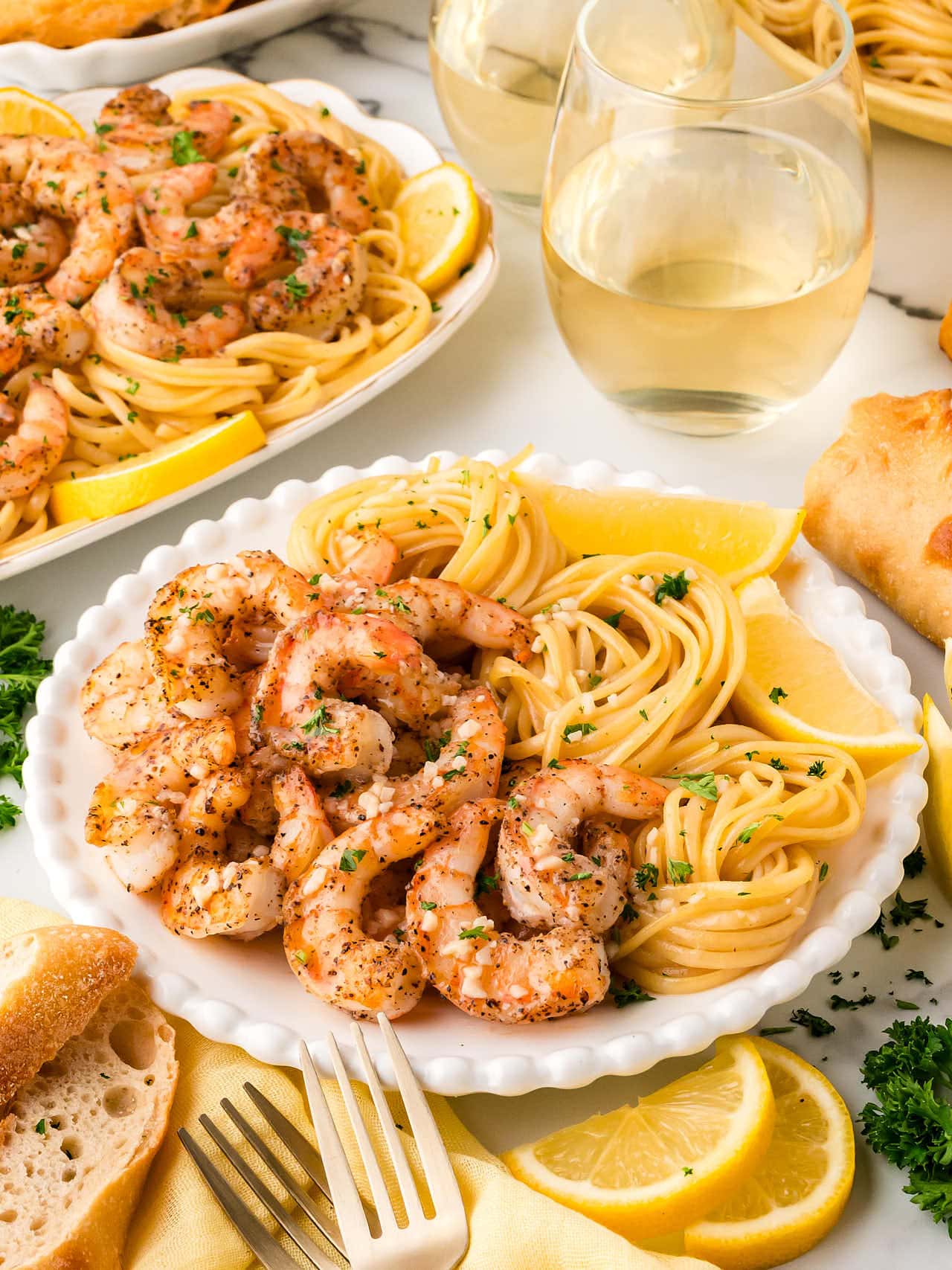 Shrimp Scampi served with Spaghetti over spaghetti.