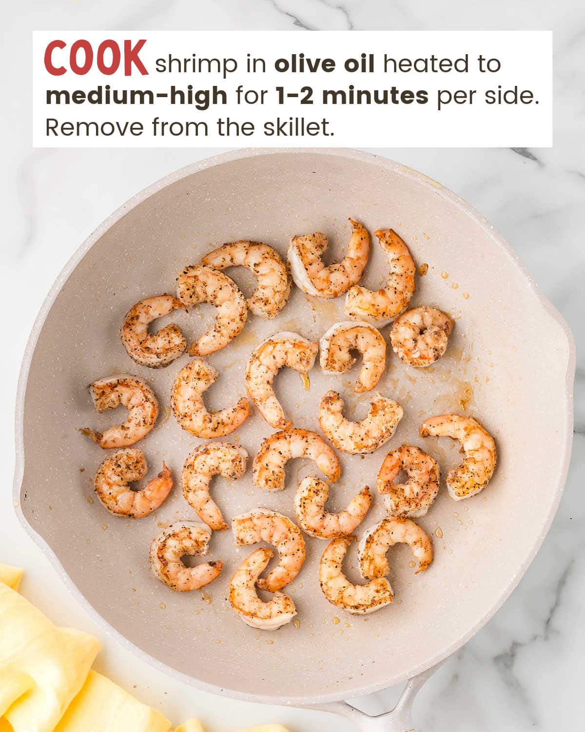 Shrimp frying in a skillet.