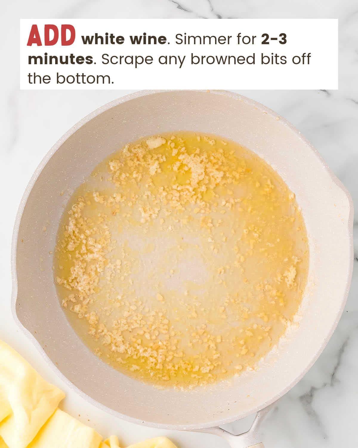 Melted butter, white wine, and garlic in a skillet.