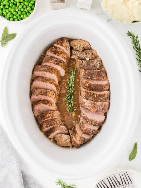 Top down view of a cooked Pork Tenderloin in a slow cooker.