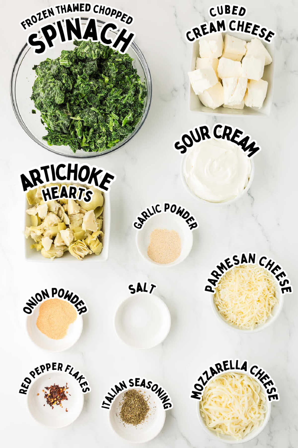 Ingredients needed to make a Slow Cooker Spinach Artichoke dip.