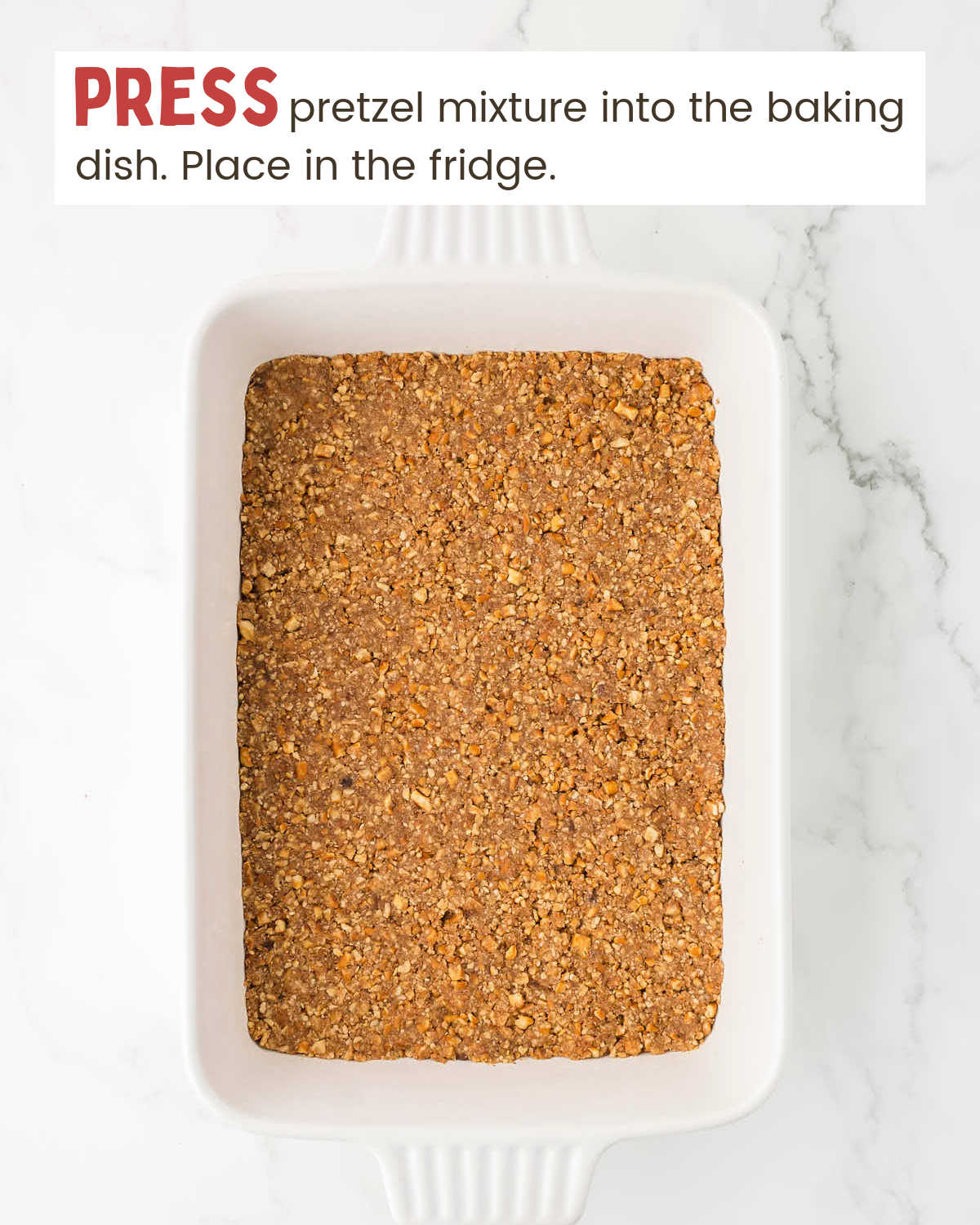 Pretzel crumb mixture pressed into a baking dish.
