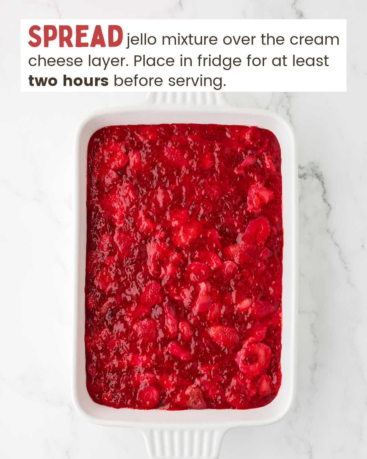Strawberry layer of Strawberry pretzel salad in a baking dish.