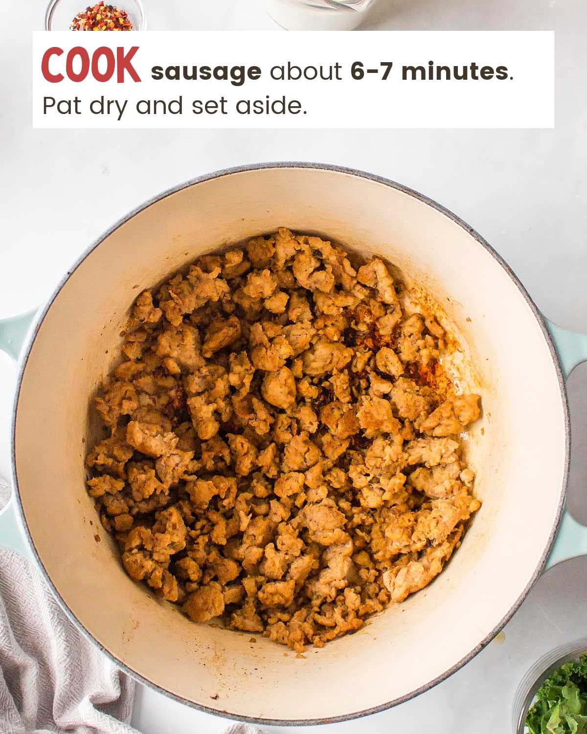 Sausage crumbles in a pot.